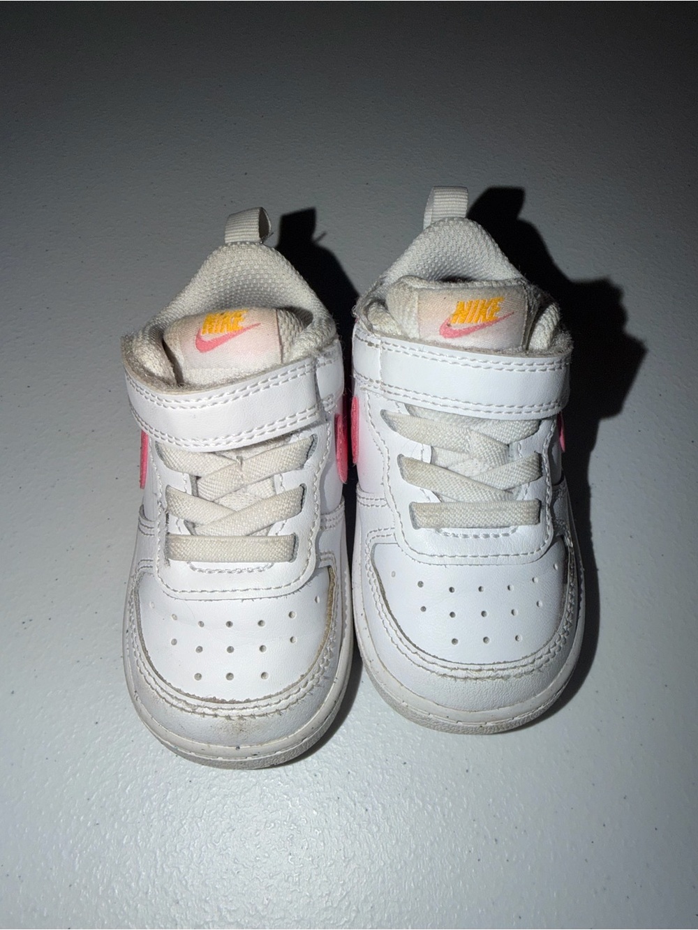 Nike White Kids Sneakers with Pink and Orange Logo Accents